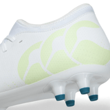 Close-up of a white Canterbury Speed Infinite Team FG rugby boot with green detailing and blue-tipped studs, featuring a lightweight design.