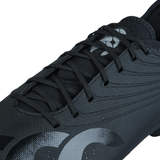 Close-up of a black Canterbury Stampede Groundbreak Pro SG soccer cleat featuring a textured surface and laces. The cleat showcases a silver metallic logo and curved lines design on the side, ensuring optimal power transfer and traction on soft ground.