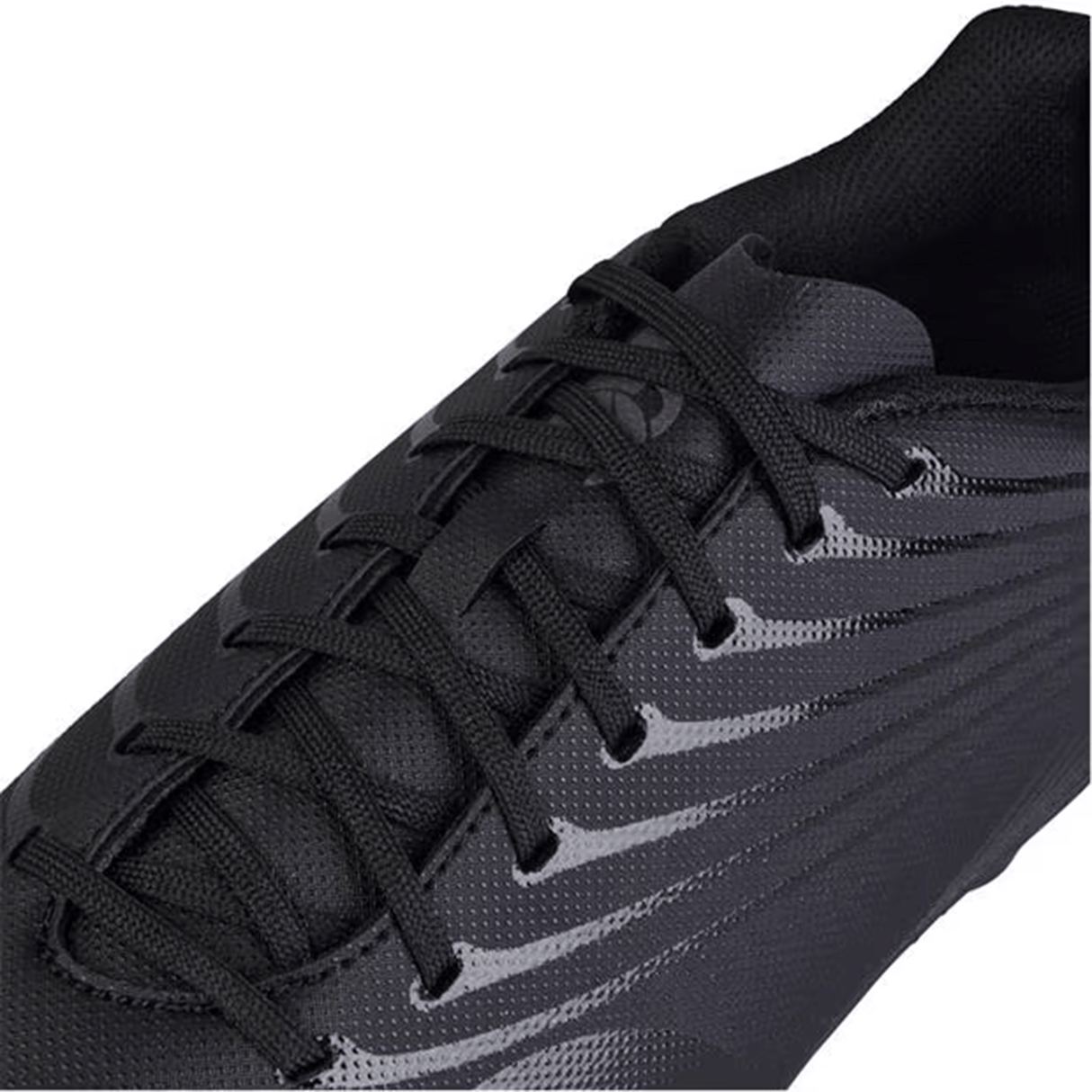 Close-up of a black athletic shoe featuring a lace-up design and glossy silver metallic accents on the side, part of the Canterbury Stampede Groundbreak Team SG collection. Perfect for soft ground use, it includes a stud tightening tool for enhanced performance.