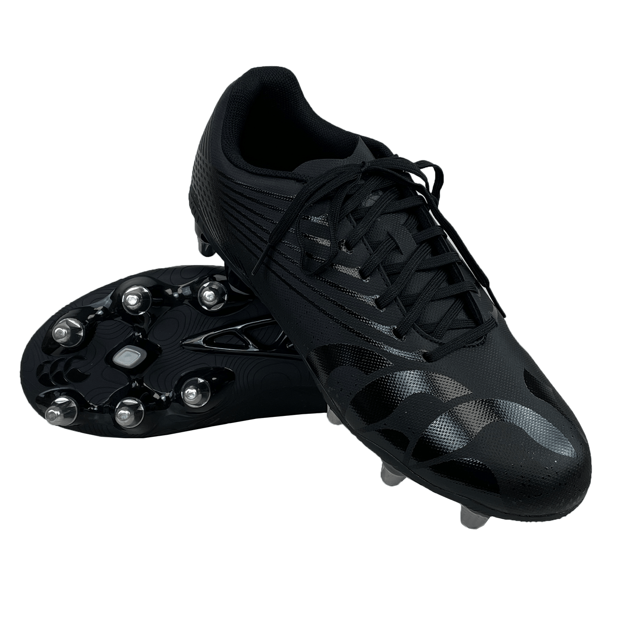 A pair of Canterbury Stampede Groundbreak Team SG soccer cleats in Black/Silver Metallic, with one cleat upright and the other lying on its side, displaying metal studs on the sole. These soft ground boots are equipped with an EVA footbed for enhanced comfort.