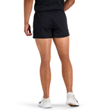 A person wearing Canterbury Classics Rugged Drill Short by Canterbury, with an elasticated waist and made from 100% cotton drill, is standing back to the camera against a white background. The look is completed with classic white sneakers.