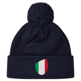 The newly released navy blue Italy Shield Pom Pom Beanie from EMB Canterbury features a striking shield emblem on the front.