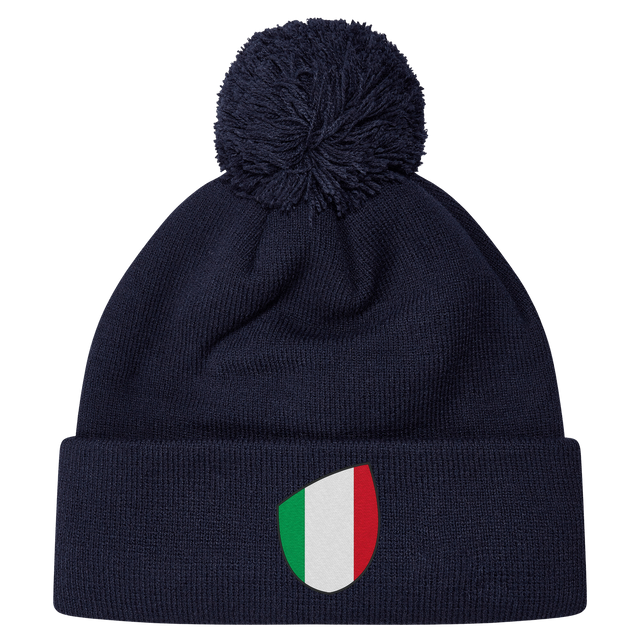 The newly released navy blue Italy Shield Pom Pom Beanie from EMB Canterbury features a striking shield emblem on the front.