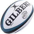 A white and blue rugby ball branded as "Gilbert," with the model name "Kinetica Match Ball," boasting a G-X rubber compound surface and a Truflight valve designed for optimal performance.