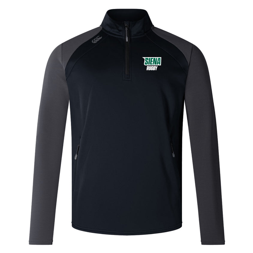 The Siena College Elite 1/4 Zip Top by EMB Canterbury blends performance and comfort with its long sleeves and quarter-zip. Featuring the Siena Rugby logo on the chest, this black and gray pullover is crafted from lower-impact materials for an eco-conscious choice.