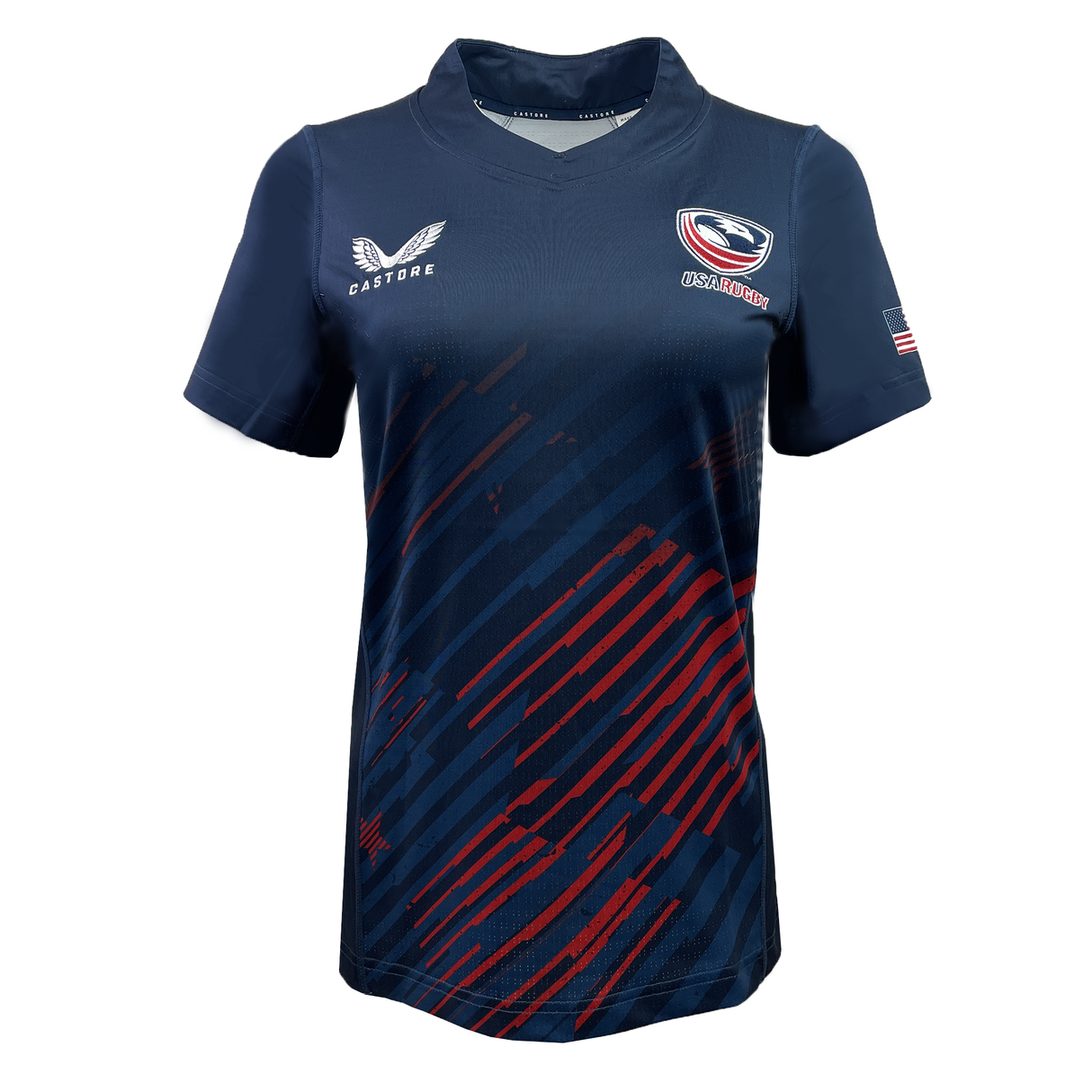 The Women's USA Rugby Pro Home Jersey by Castore features a navy blue design with abstract red stripes, a USA flag patch on the sleeve, and various logos including a winged emblem. Tailored for an athletic fit, it uses moisture-wicking fabric to ensure comfort throughout any match.