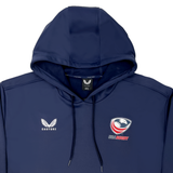 The USA Rugby Brush Back Overhead Hoodie by Castore features navy blue fabric with the iconic "Castore" logo on the left and "USA Rugby" logo on the right, perfect for fans.