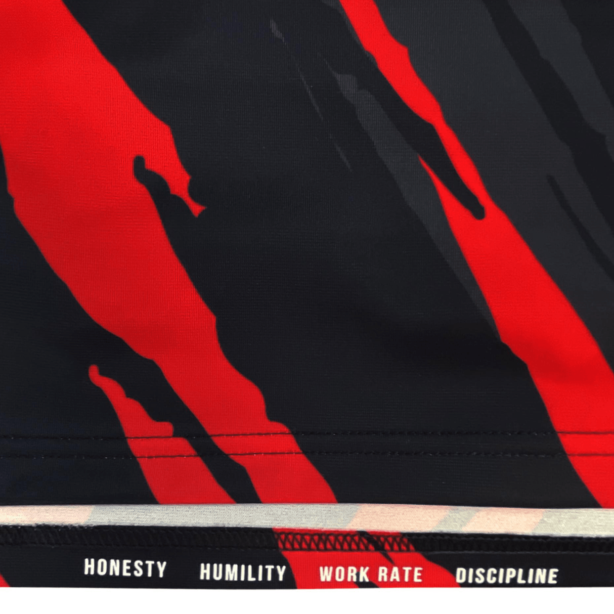 A close up of a Saracens Home Jersey 23/24 by Castore with the words 'honesty' and 'humility'.