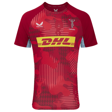 Wear the eye-catching Harlequins 24/25 Matchday Tee by Castore, designed with moisture-wicking technology. Featuring the bold "DHL" logo and detailed patterns, this tee also boasts the Castore and Heineken logos on the chest, making it ideal for any Harlequins Rugby fan.