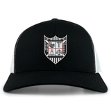 Troy University Rugby Retro Trucker Cap with a shield emblem featuring various embroidered symbols on the front by EMB Alpha Broder.