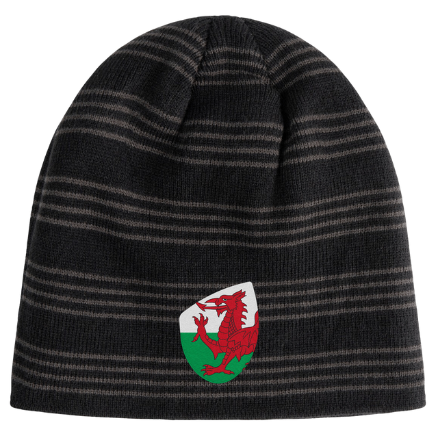 The Wales Shield Beanie by EMB Canterbury is a black and gray striped beanie showcasing a fierce red dragon emblem on a classic white and green shield.