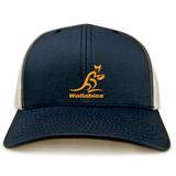 The Wallabies Retro Trucker Cap by EMB Alpha Broder comes in dark blue and white, showcasing an orange kangaroo logo and the word "Wallabies" in orange on the front. It also features a convenient snapback closure, making it perfect for fans of Australia's rugby team.