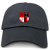 The Amoskeag Rugby Club Adult Low-Profile Cotton Twill Dad Cap by EMB Alpha Broder features a cotton twill construction with an embroidered red and black shield emblem that includes a ram, "Amoskeag," a triangle with "Est. 1984," and a rugby ball design for stylish detail.