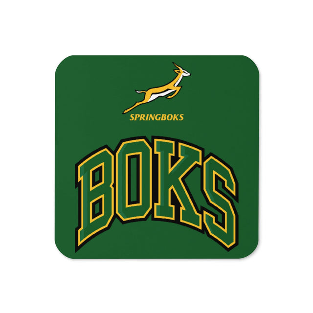 A green Springboks 'BOKS' cork-back coaster with the word boks on it, perfect for rugby friends and family, made by PF LIC.