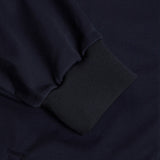 Close-up of a navy blue Canterbury Elite Windstopper Jacket, focusing on the texture and the folded sleeve detail.