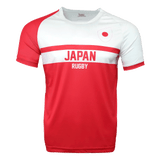 Round neck short sleeve jersey. Right sleeve red, white chest, Japan flag on chest, red stripe center of chest with Japan and Rugby underneath. Red torso.