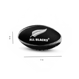 A black and white photo of a Gilbert All Blacks Supporters Rugby Ball (Mini).