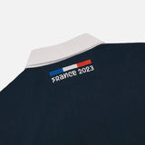 Detail image of white collar with the blue, white and red strip France 2023 below the collar.