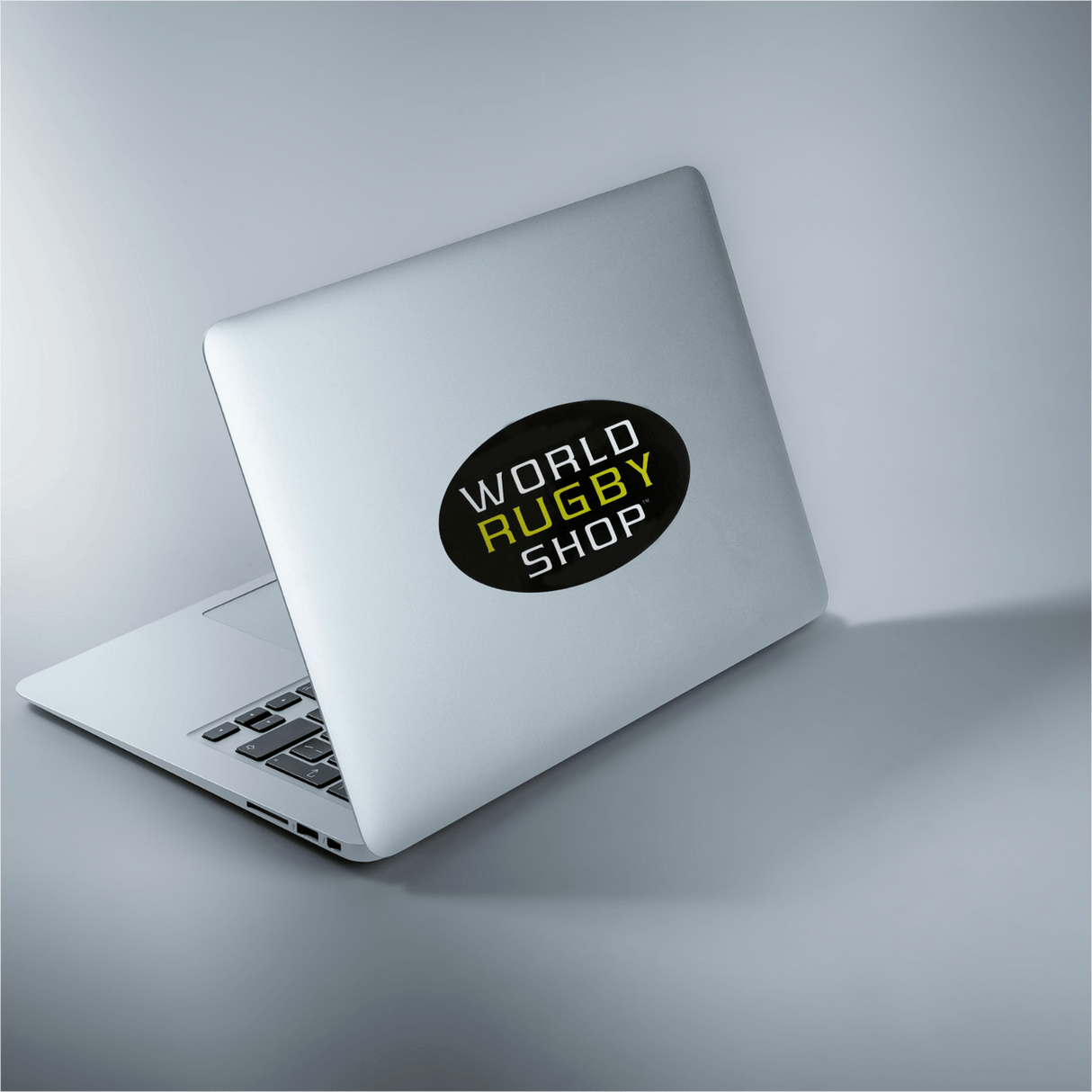 A laptop with a World Rugby Shop Sticker Sheet - 19 Stickers from the brand World Rugby Shop on it.