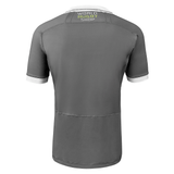 Gray poly short sleeve jersey with white collar and sleeve trim. World Rugby Shop under collar in center between the black stitched lines that run across the shoulders and back.