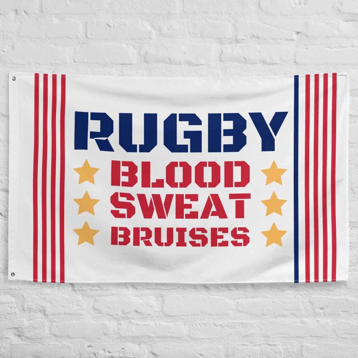 White brick wall with a white flag with red and blue stripes, yellow stars, and 'RUGBY, BLOOD, SWEAT, BRUISES' inscription