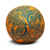 End of orange Wallabies ball with green indigenous design. 