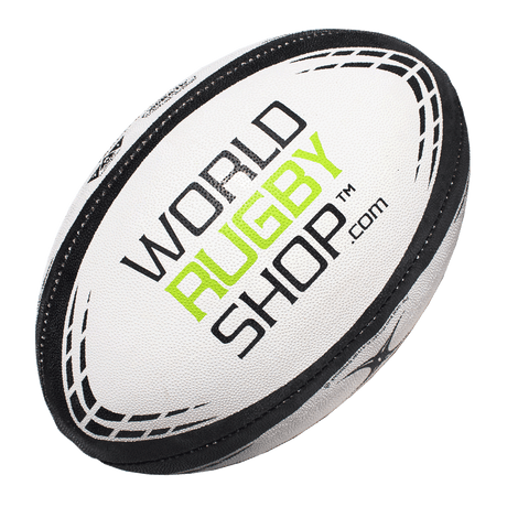 A white Gilbert rugby ball with the word "World Rugby Shop" on it.