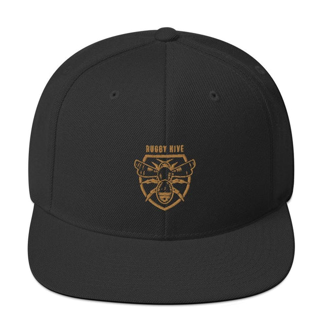 A black Rugby Hive Snapback Hat with a gold bear head on it.