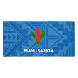 Gaming mouse pad with a blue on blue geometric design and Manu Samoa logo.