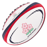 A Gilbert rugby ball with the Japan Replica Ball logo on it.