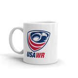 The PF LIC USA Wheelchair Rugby Mug is a white ceramic mug adorned with the "USA WR" logo and showcases a stylish design in red, white, and blue. It is both dishwasher and microwave safe.