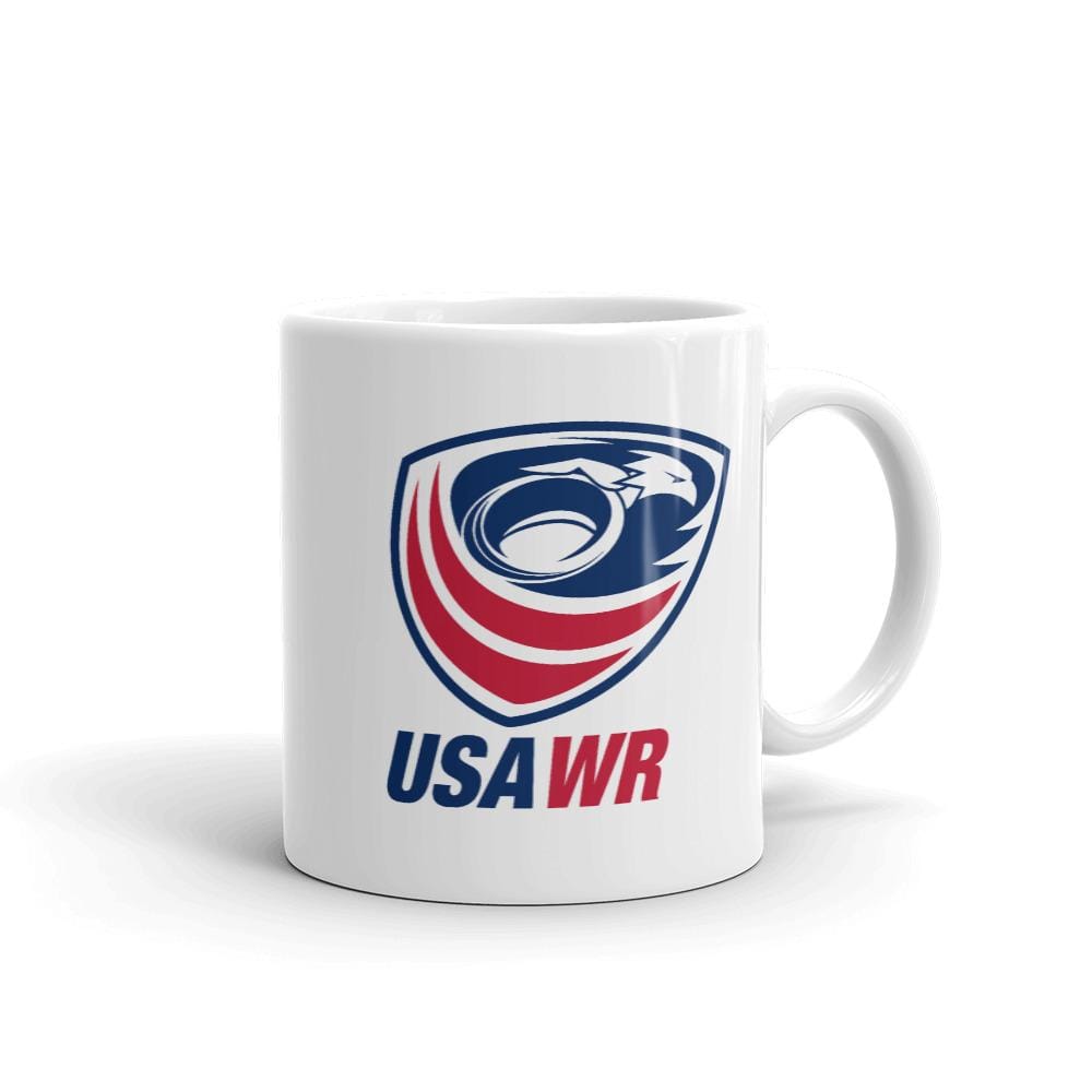 The USA Wheelchair Rugby Mug by PF LIC is a ceramic white mug showcasing the USA Wheelchair Rugby logo, which includes an eagle head and red, white, and blue stripes with "USA WR" underneath. This mug is both dishwasher and microwave safe.