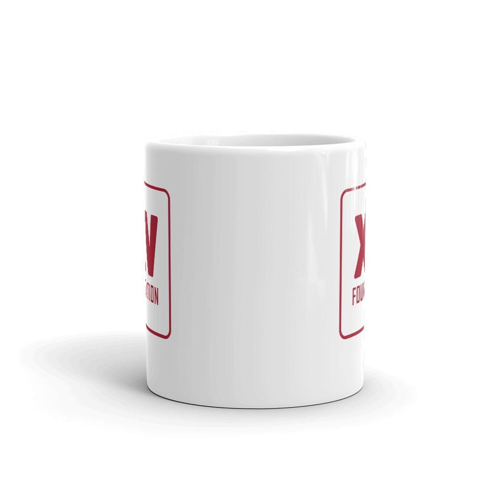 A XV Foundation Mug with a red x on it.