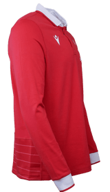 A side view of the Wales Long Sleeve Home Polo 22/23 by Macron, showcasing its red color, white collar, and triangular logo on the chest.