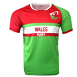 Wales rugby round neck short sleeve jersey. Upper red back, right shoulder and sleeve, white round collar, and green left shoulder and sleeve trimmed in red. Green horizontal stripe across the upper chest with white stripe below and red stripe below the white. Green lower torso.  