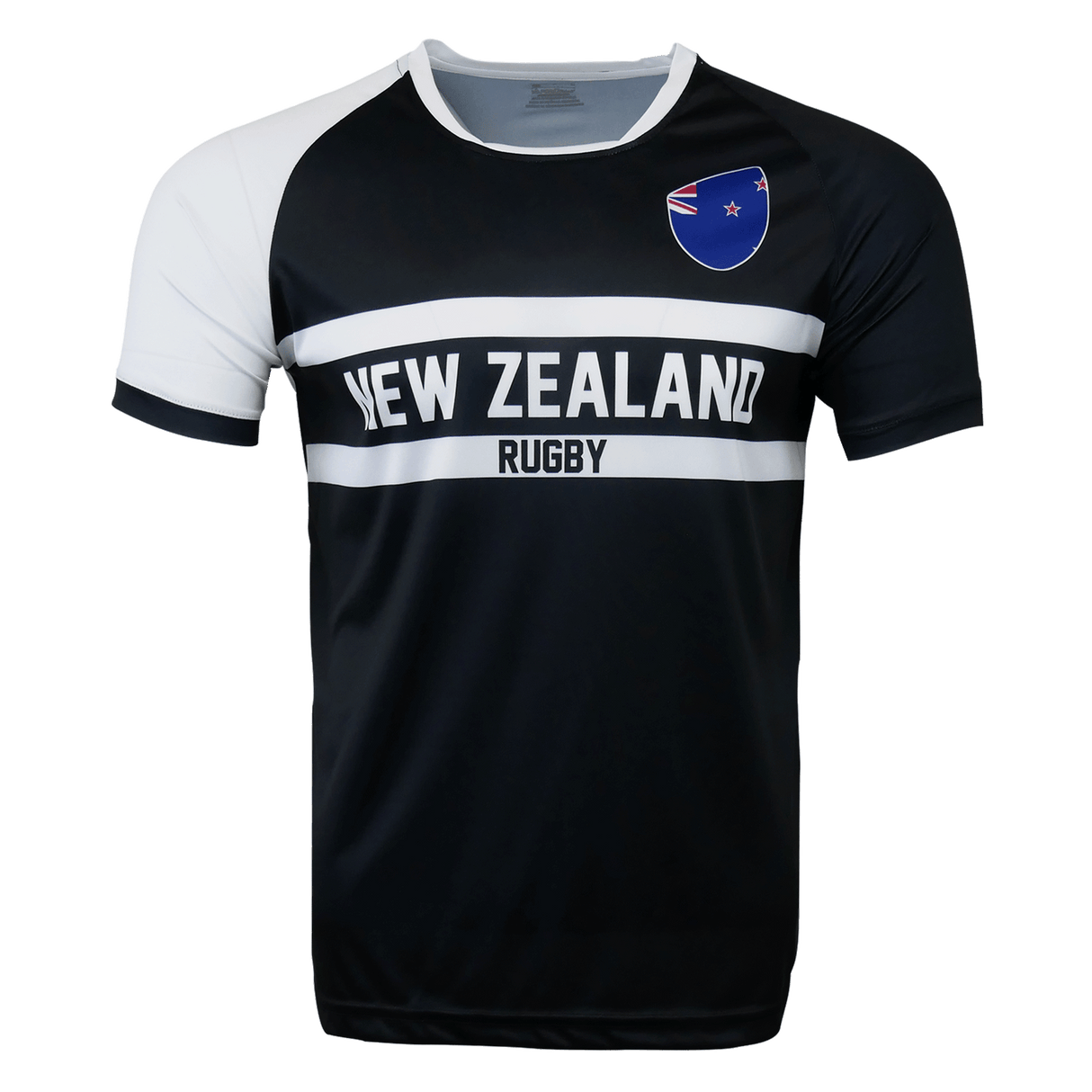 Round neck short sleeve jersey. White right shoulder trimmed in black. Chest and right shoulder in black. Two white center stripes with New Zealand in the center and Rugby below. The New Zealand flag sits on the upper left chest.