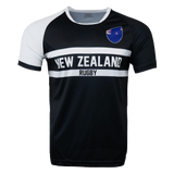 Round neck short sleeve jersey. White right shoulder trimmed in black. Chest and right shoulder in black. Two white center stripes with New Zealand in the center and Rugby below. The New Zealand flag sits on the upper left chest.